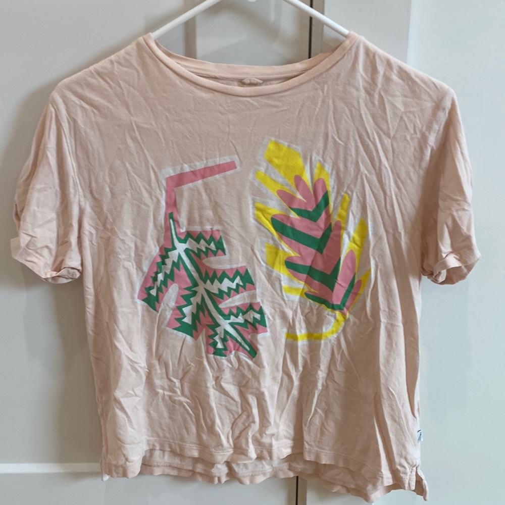 This is a light pink Stella McCartney T-shirt. It is size 14 kids.